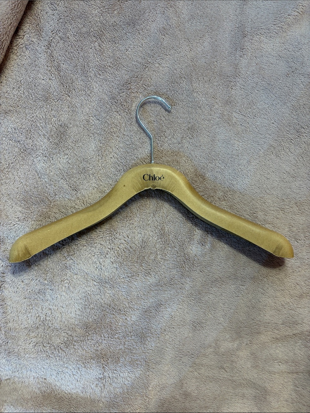 Clothing Hanger - has the text “Chloé”